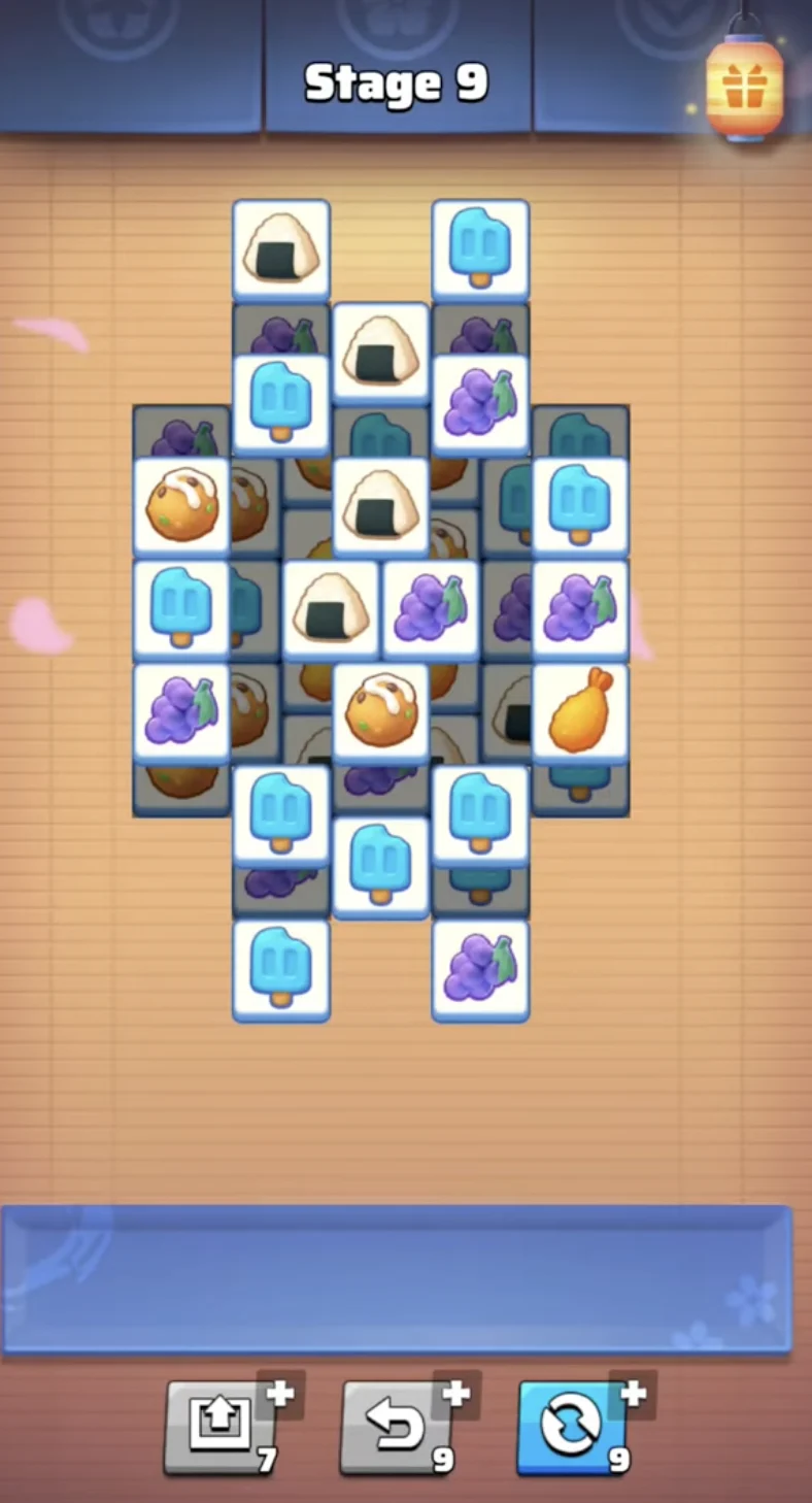 Gameplay of the Ryotei Restaurant match-3 tile game showing the 7-slot tray and helper items.